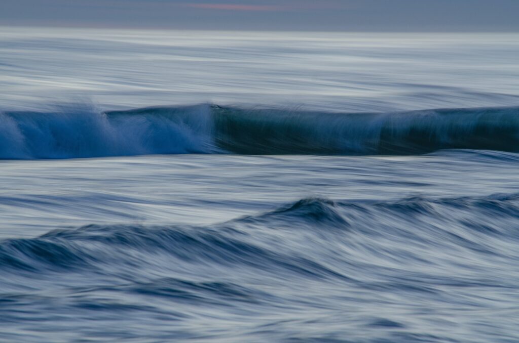 Photo of waves building and crashing within the water